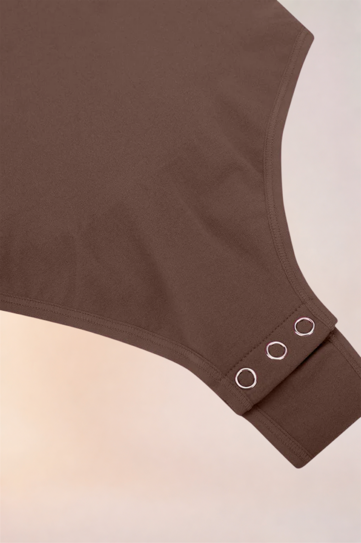 Flat lay of the Skinzform Contour Bodysuit in Cacao showing the snap gusset