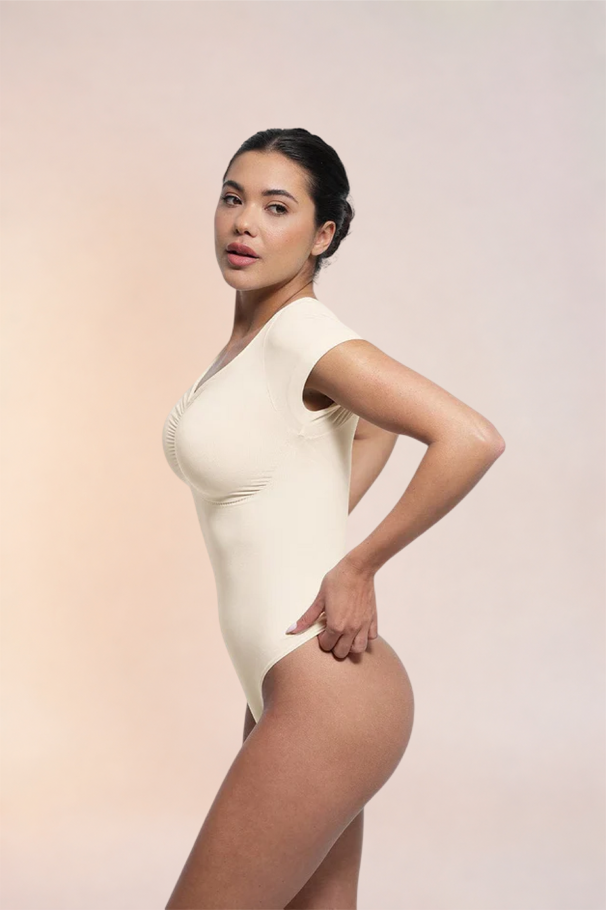 Skinzform Contour Bodysuit in Blanc, side view on the model