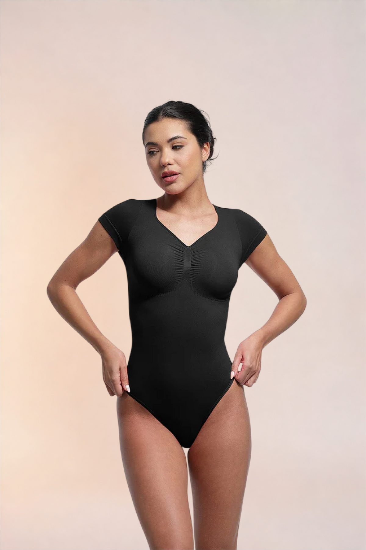 Skinzform Contour Bodysuit in Noir - angled front view on the model