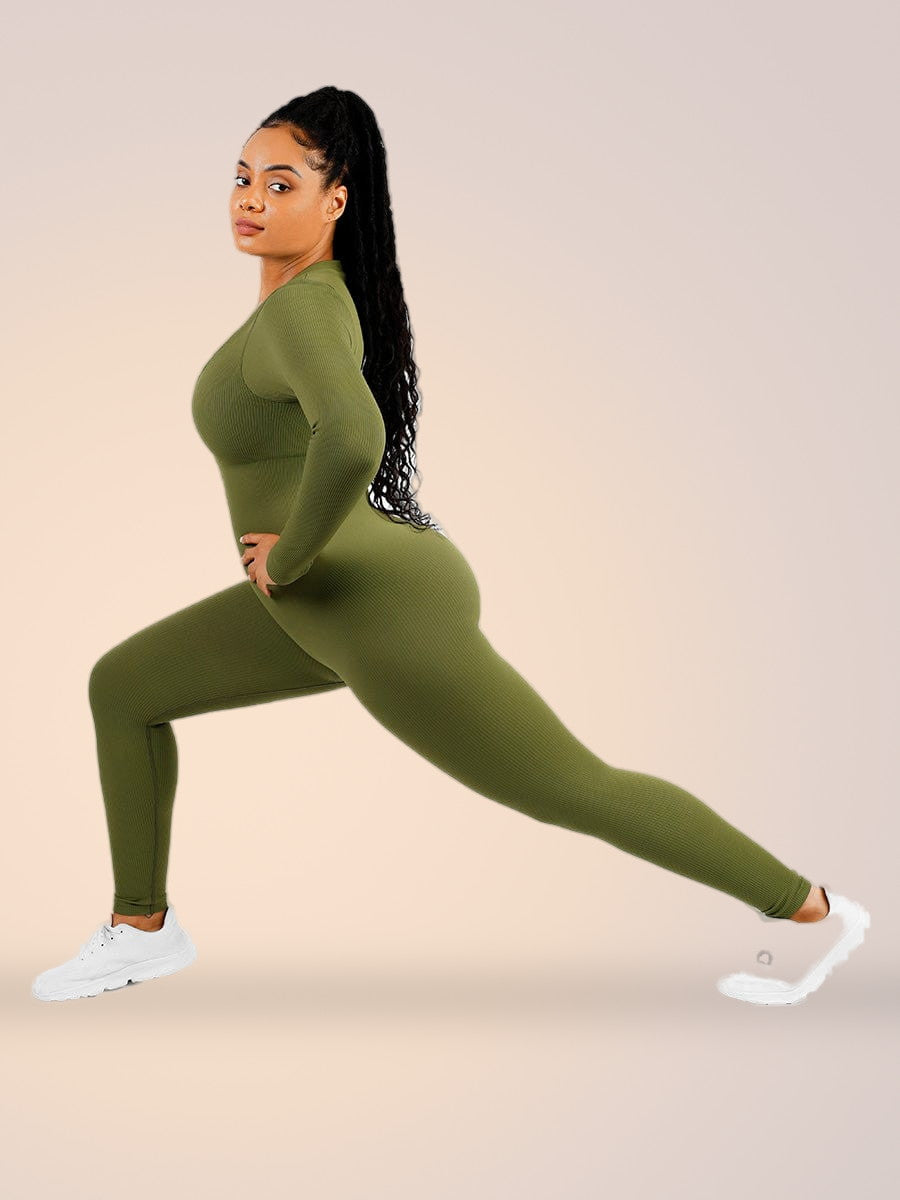 Skinzform Deep V Jumpsuit in Sage, side view - model in a lunge showing four-way stretch