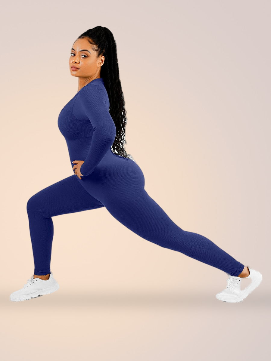 Skinzform Deep V Jumpsuit in Royal Blue - model in a lunge, side view