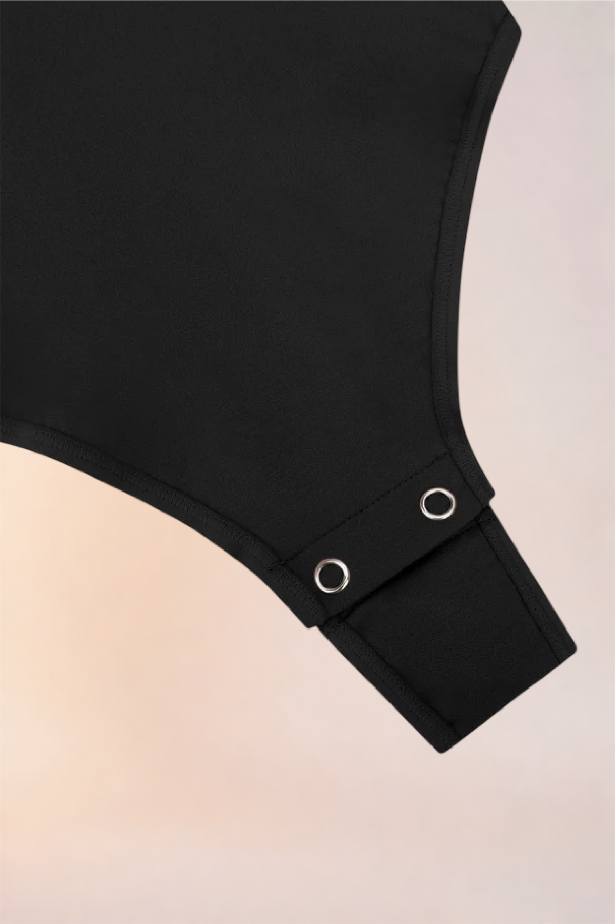 Flat lay of the Skinzform Diamant Bodysuit in Noir showing the snap gusset