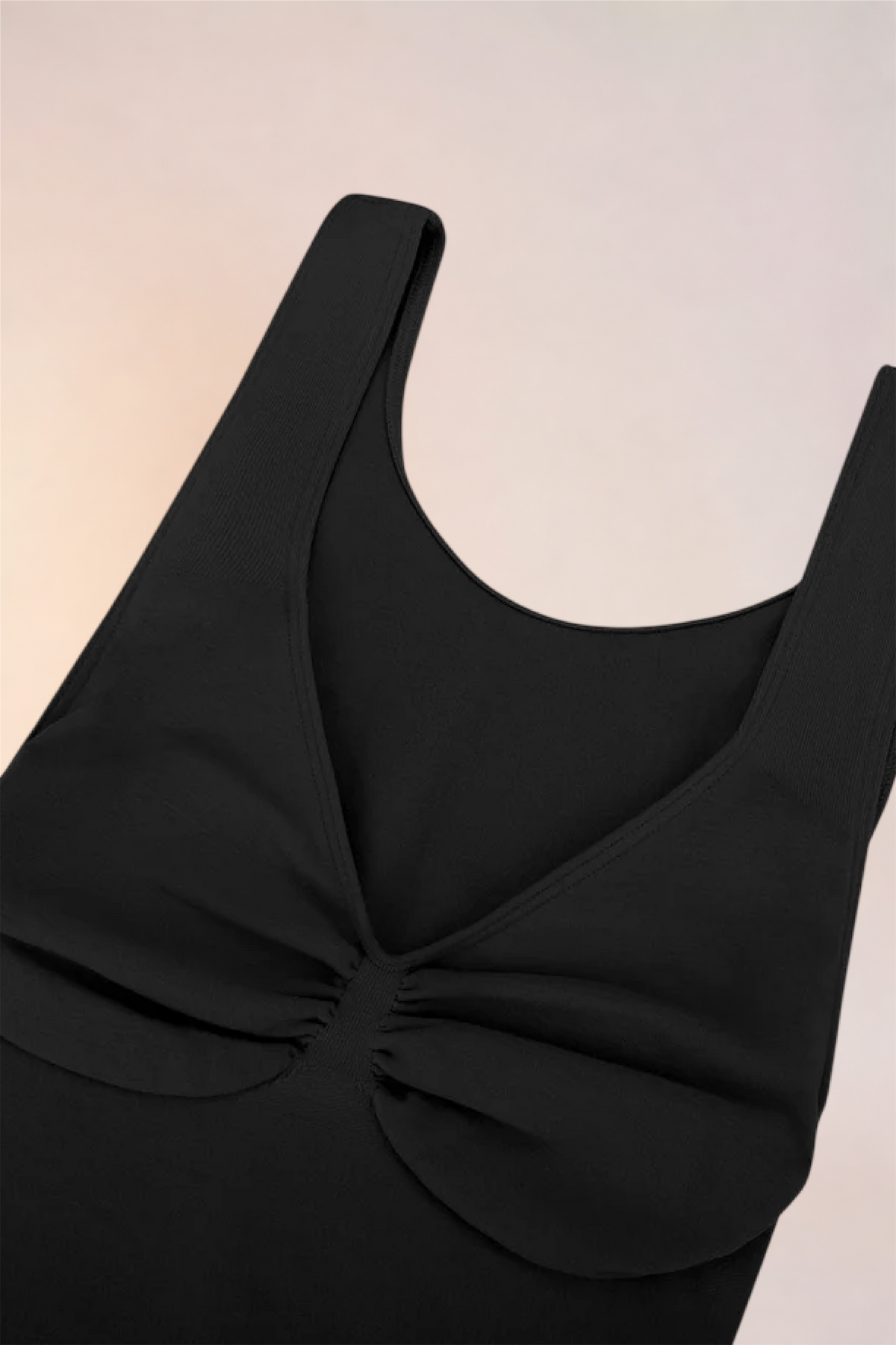 Flat lay of the Skinzform Diamant Bodysuit in Noir showing the gathered bust panel