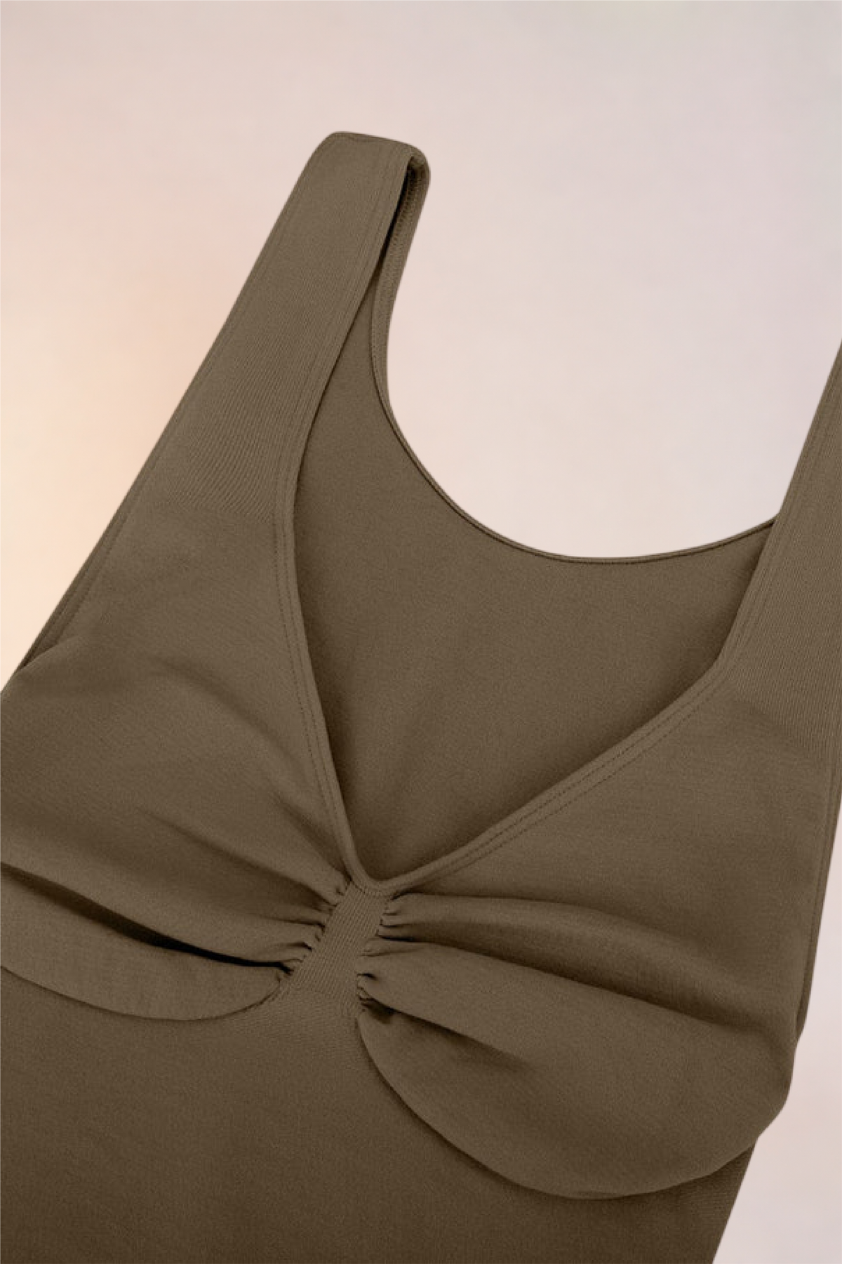 Flat lay of the Skinzform Diamant Bodysuit in Olive showing the gathered bust panel