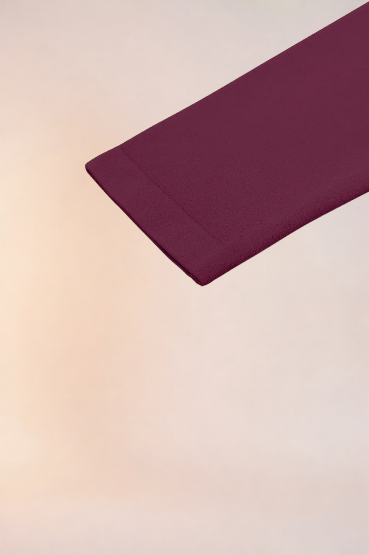 Close-up of the sleeve cuff on the Skinzform Diamant Top in Burgundy