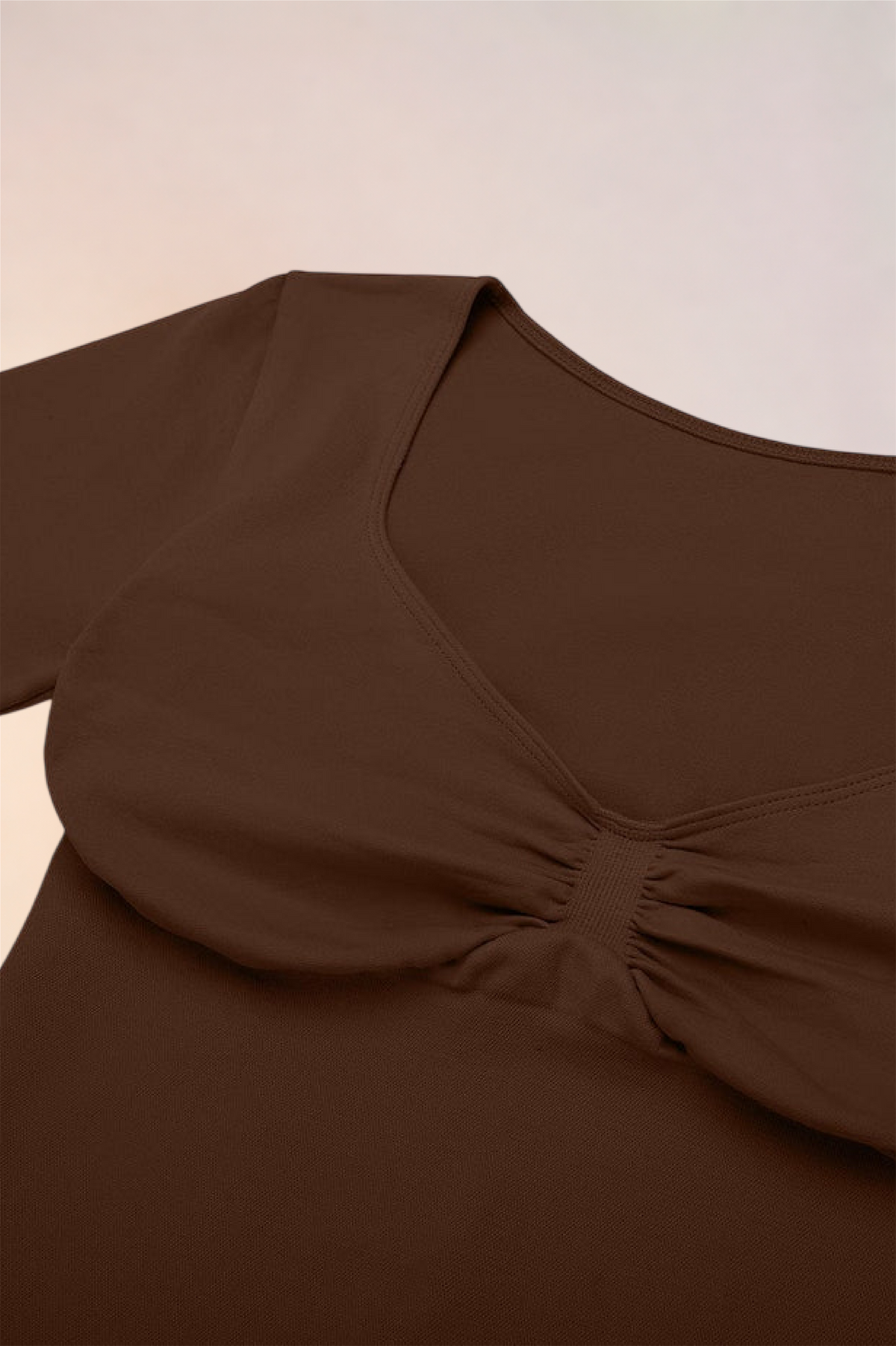 Close-up of the ruched centre front on the Skinzform Diamant Top in Cacao