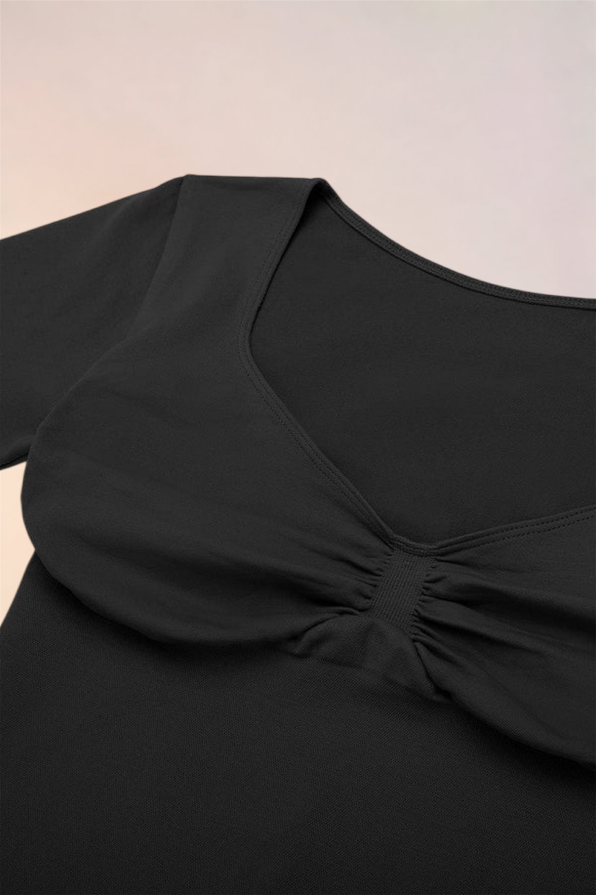 Close-up of the ruched centre front on the Skinzform Diamant Top in Noir