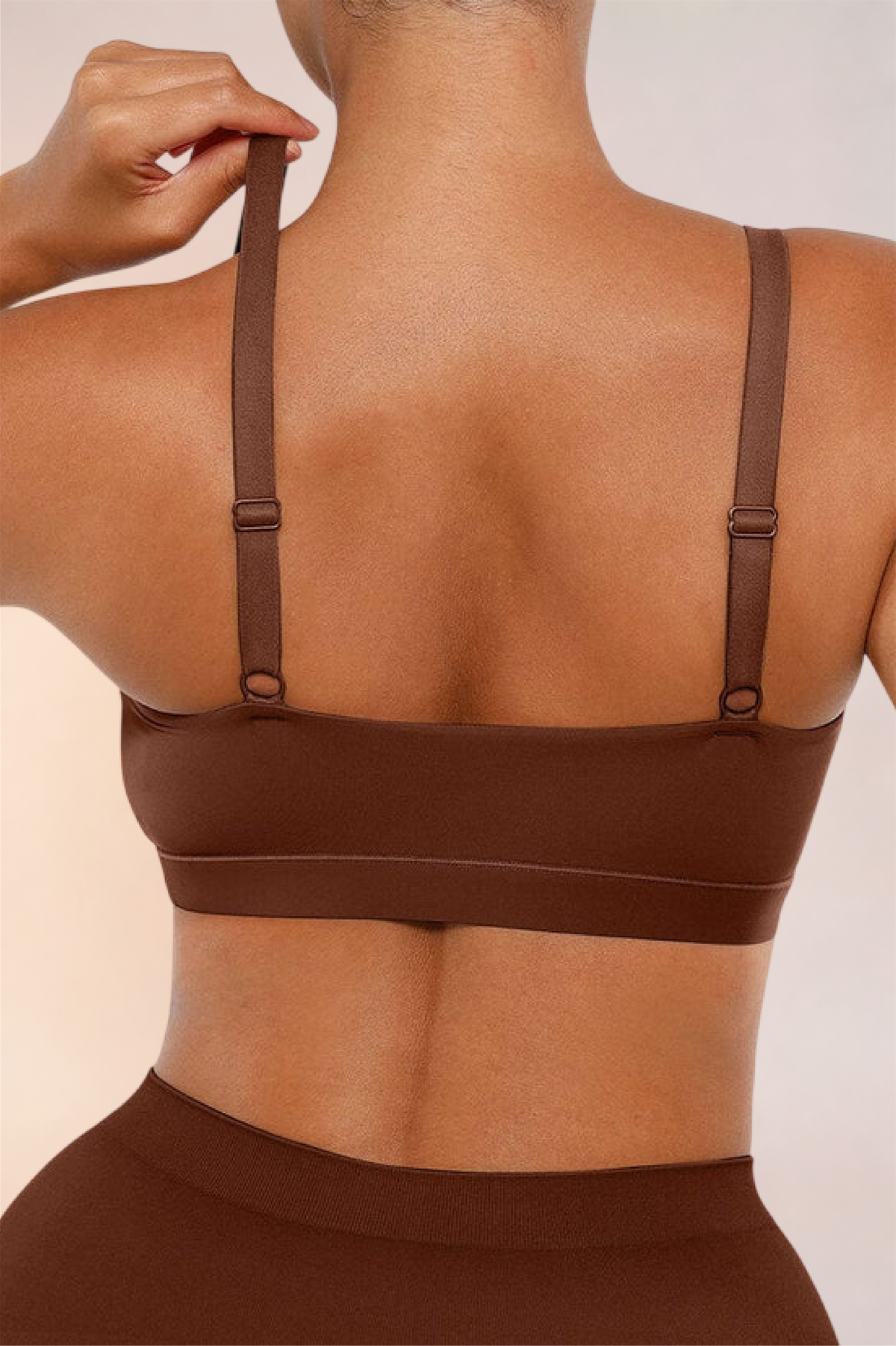 Close-up of the adjustable back straps on the Skinzform Doux Bralette in Cacao