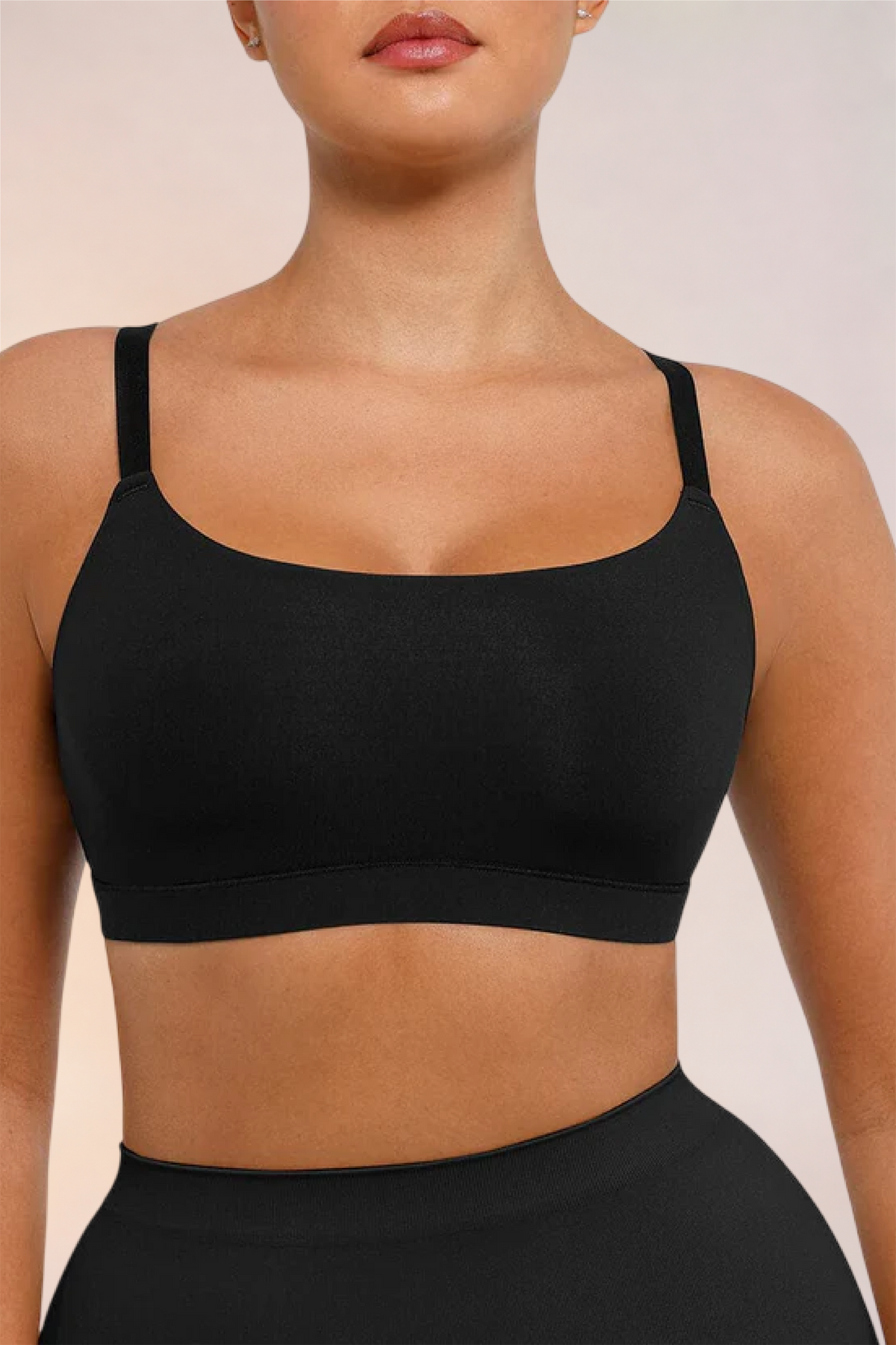 Close-up of the square neckline and cups on the Skinzform Doux Bralette in Noir