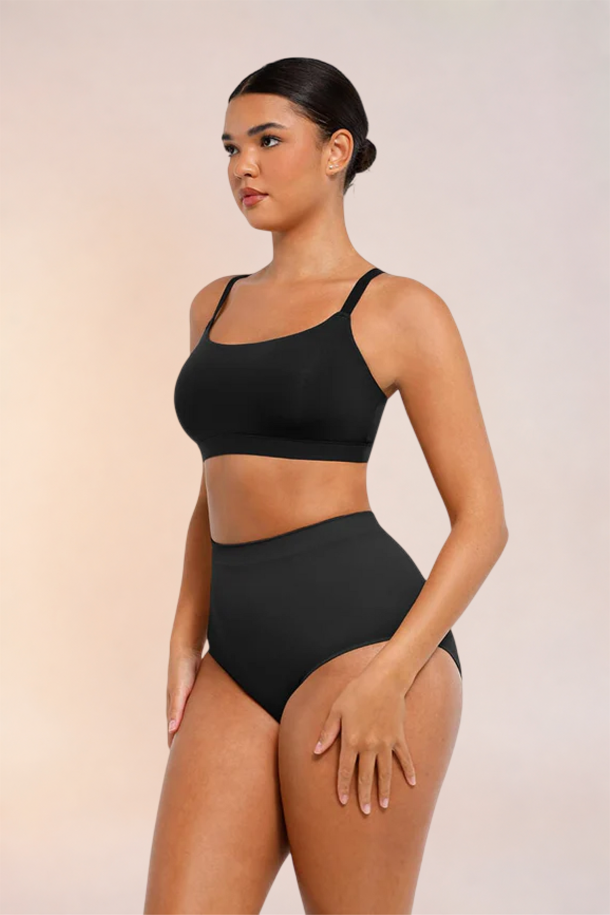 Skinzform Doux Bralette in Noir - angled front view on the model