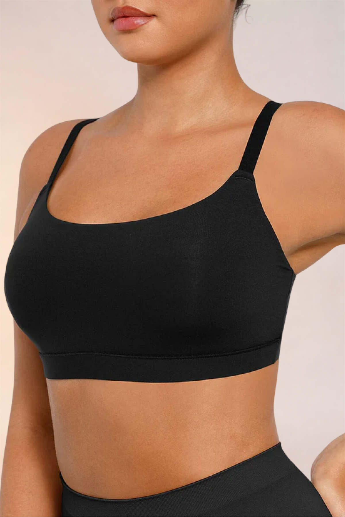 Close-up of the side seam and underarm on the Skinzform Doux Bralette in Noir