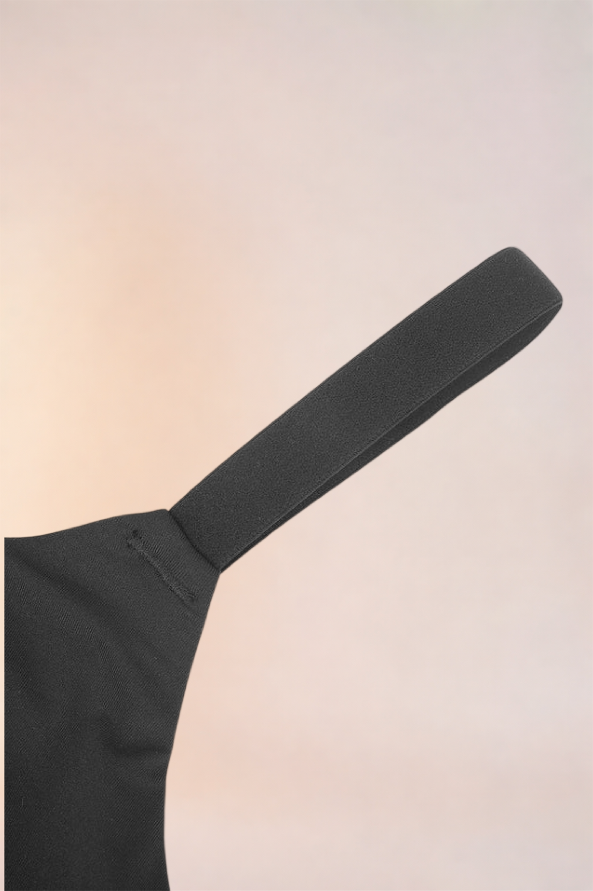 Flat lay of the adjustable strap on the Skinzform Doux Bralette in Noir