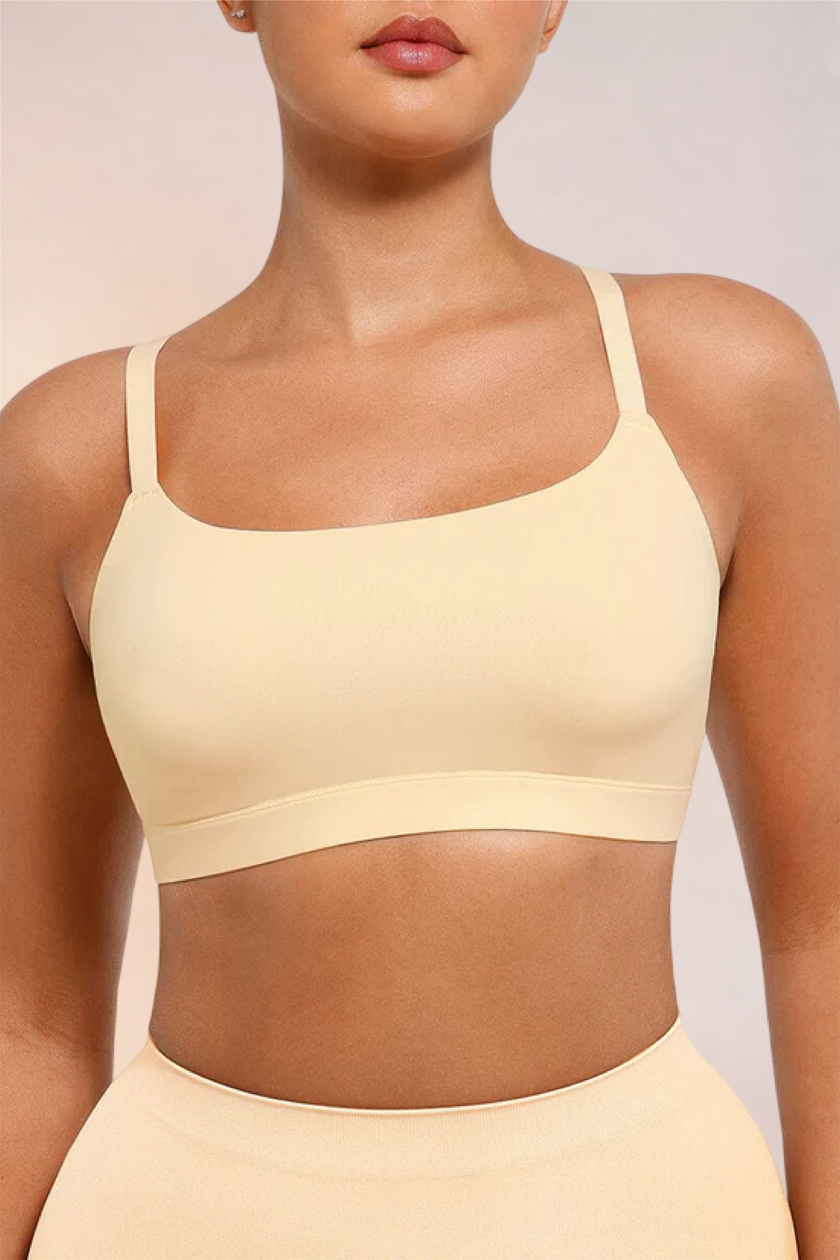 Close-up of the square neckline and cups on the Skinzform Doux Bralette in Nude