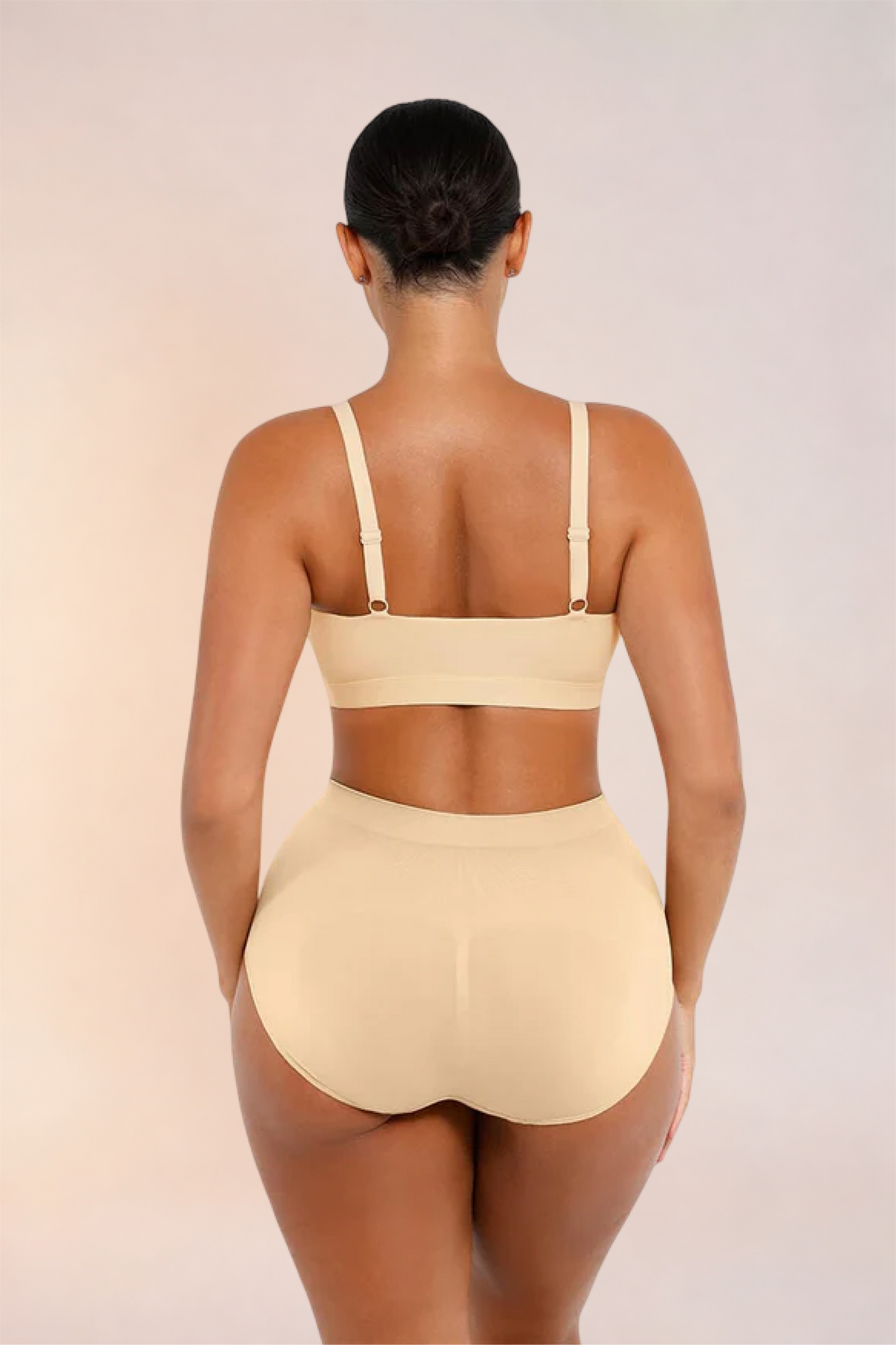 Skinzform Doux Bralette in Nude worn with matching high-waist briefs, back view