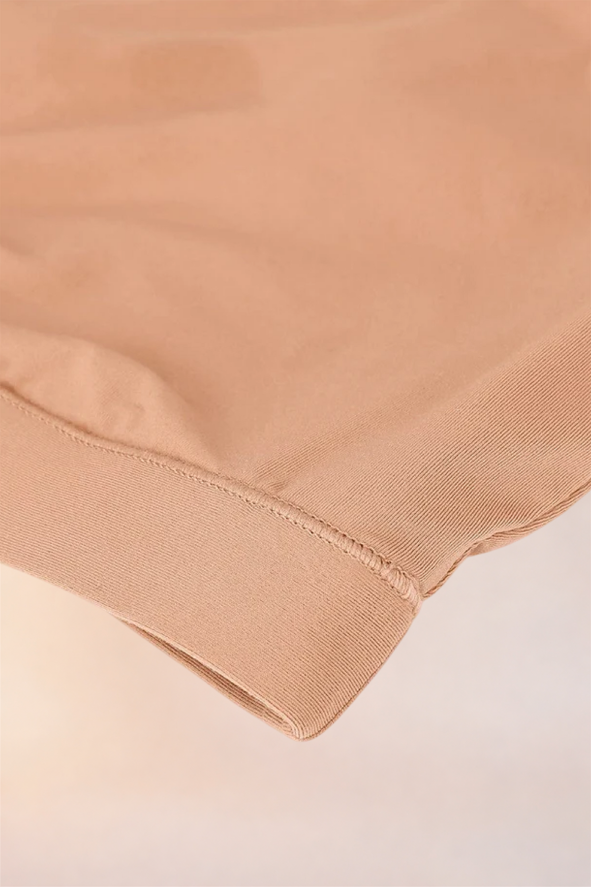Close-up of the ribbed underband on the Skinzform Doux Bralette in Beige