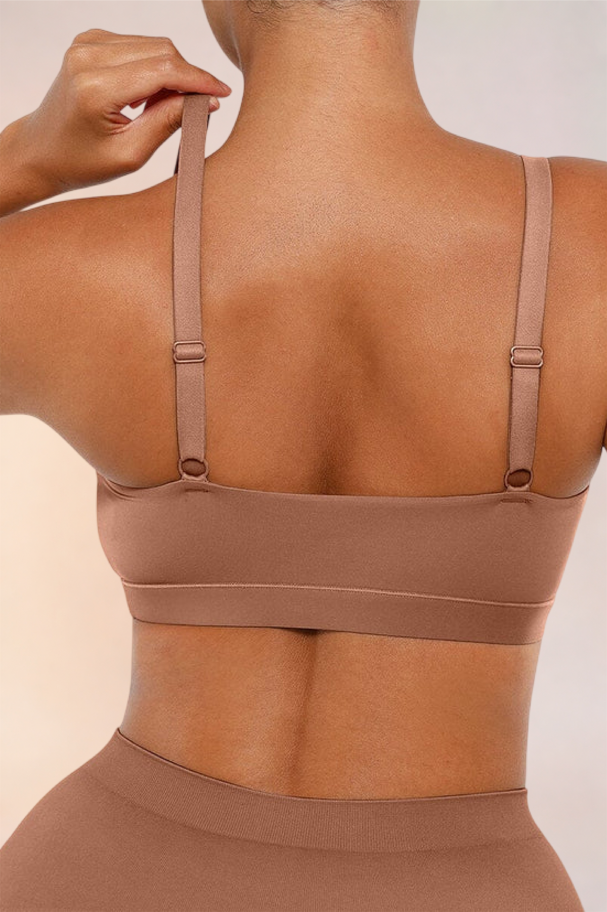 Close-up of the adjustable back straps on the Skinzform Doux Bralette in Latte