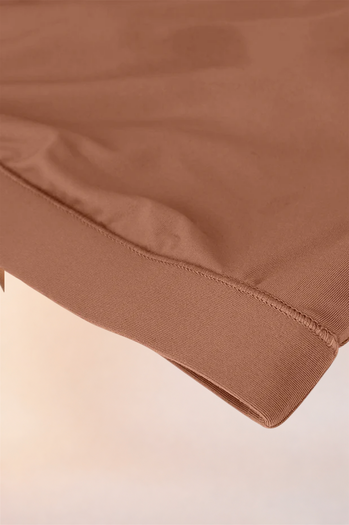 Close-up of the ribbed underband on the Skinzform Doux Bralette in Latte