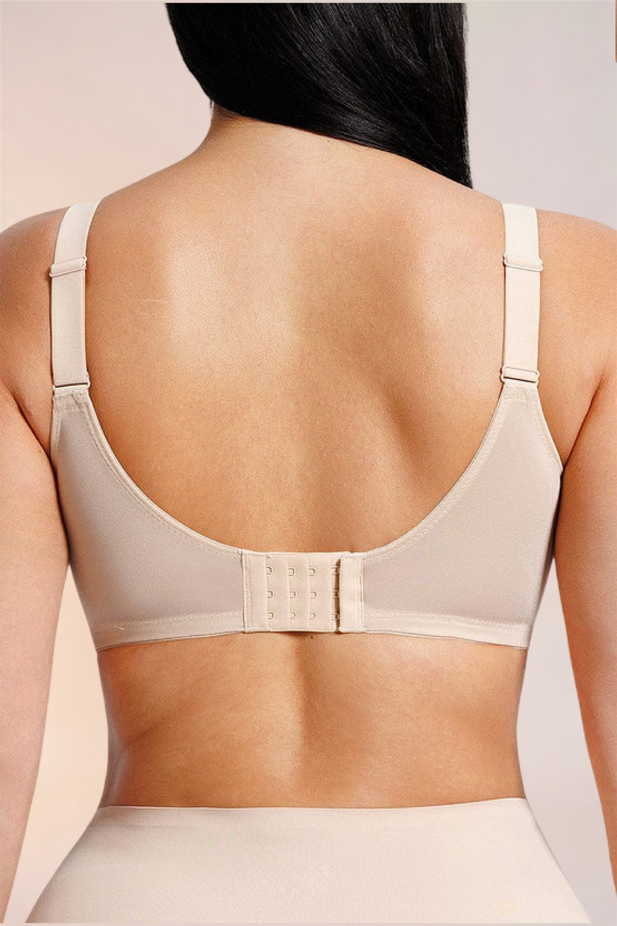Close-up of the wide back band on the Skinzform Élégance Bra in Nude