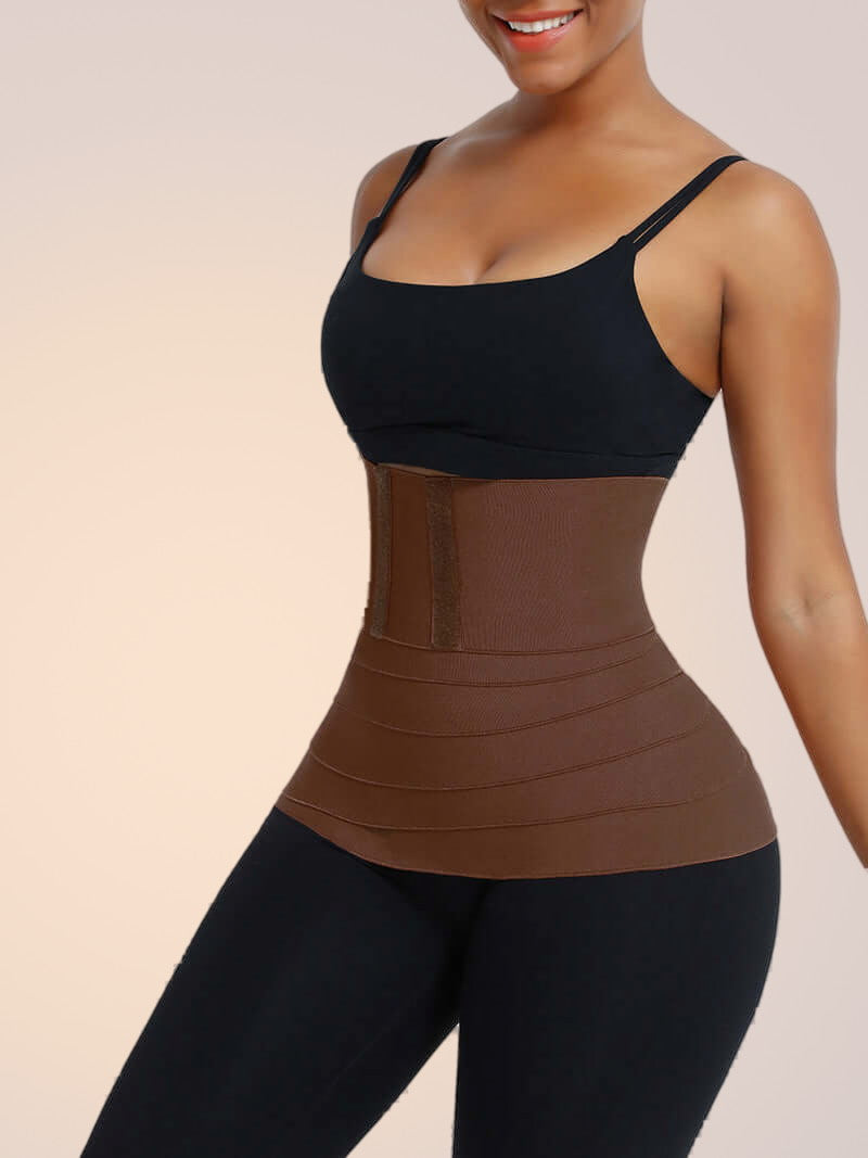 Skinzform Latex Wrap in Cacao - model wrapping the band around the waist