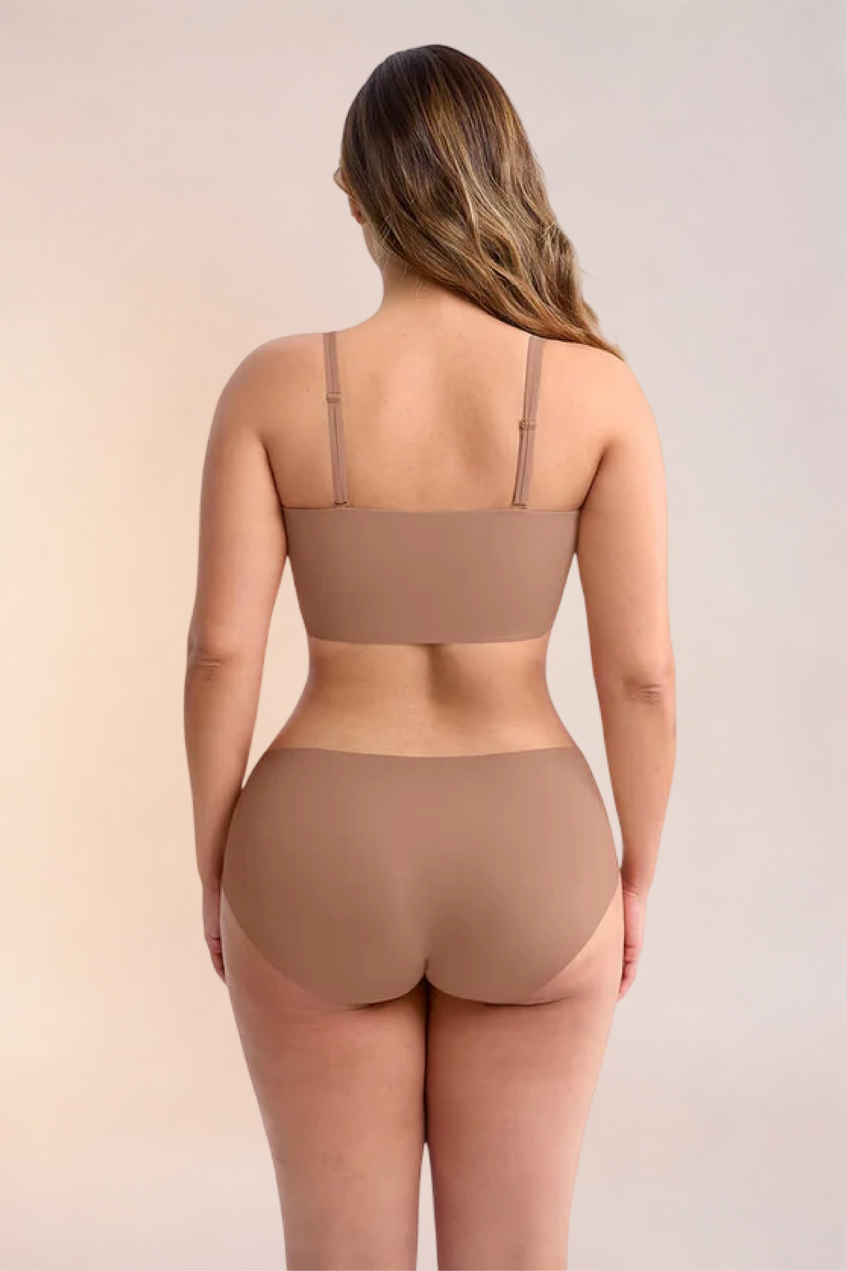 Skinzform Libre Bandeau in Latte, angled back view on the model