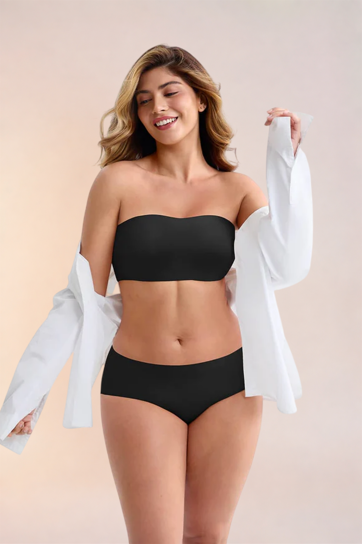 Skinzform Libre Bandeau in Noir worn with an open white shirt slipped off the shoulders