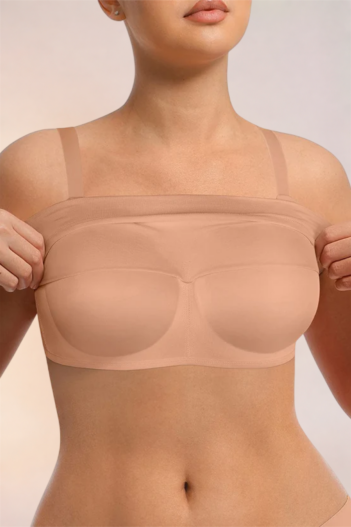 Skinzform Nuage Bra in Dark Skin - model easing the underband down