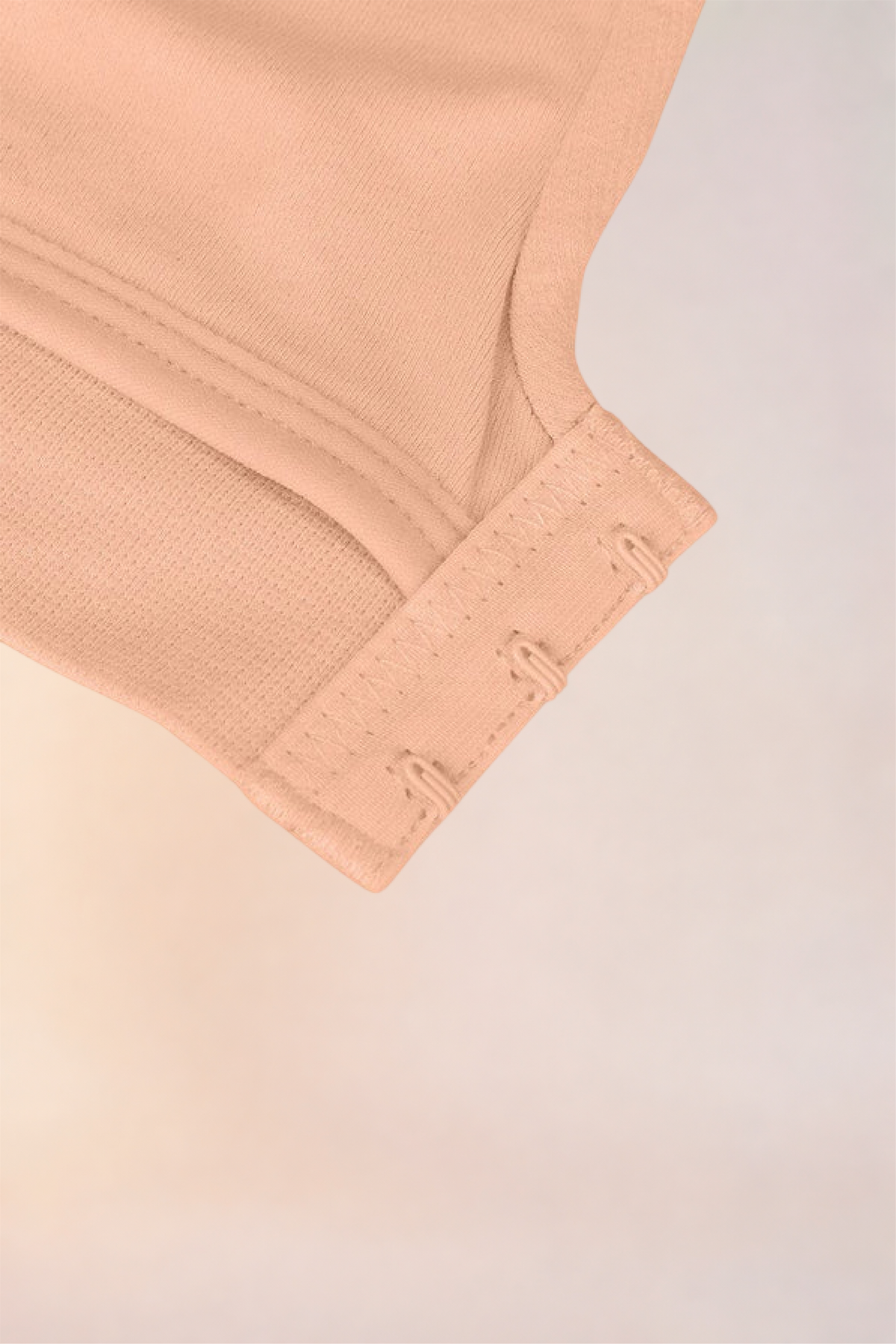 Flat lay of the Skinzform Nuage Bra in Dark Skin showing the hook-and-eye band