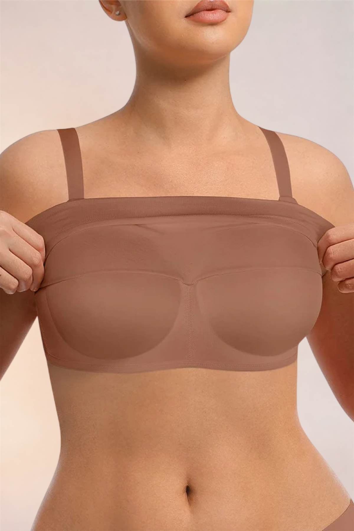 Skinzform Nuage Bra in Latte - model easing the underband down