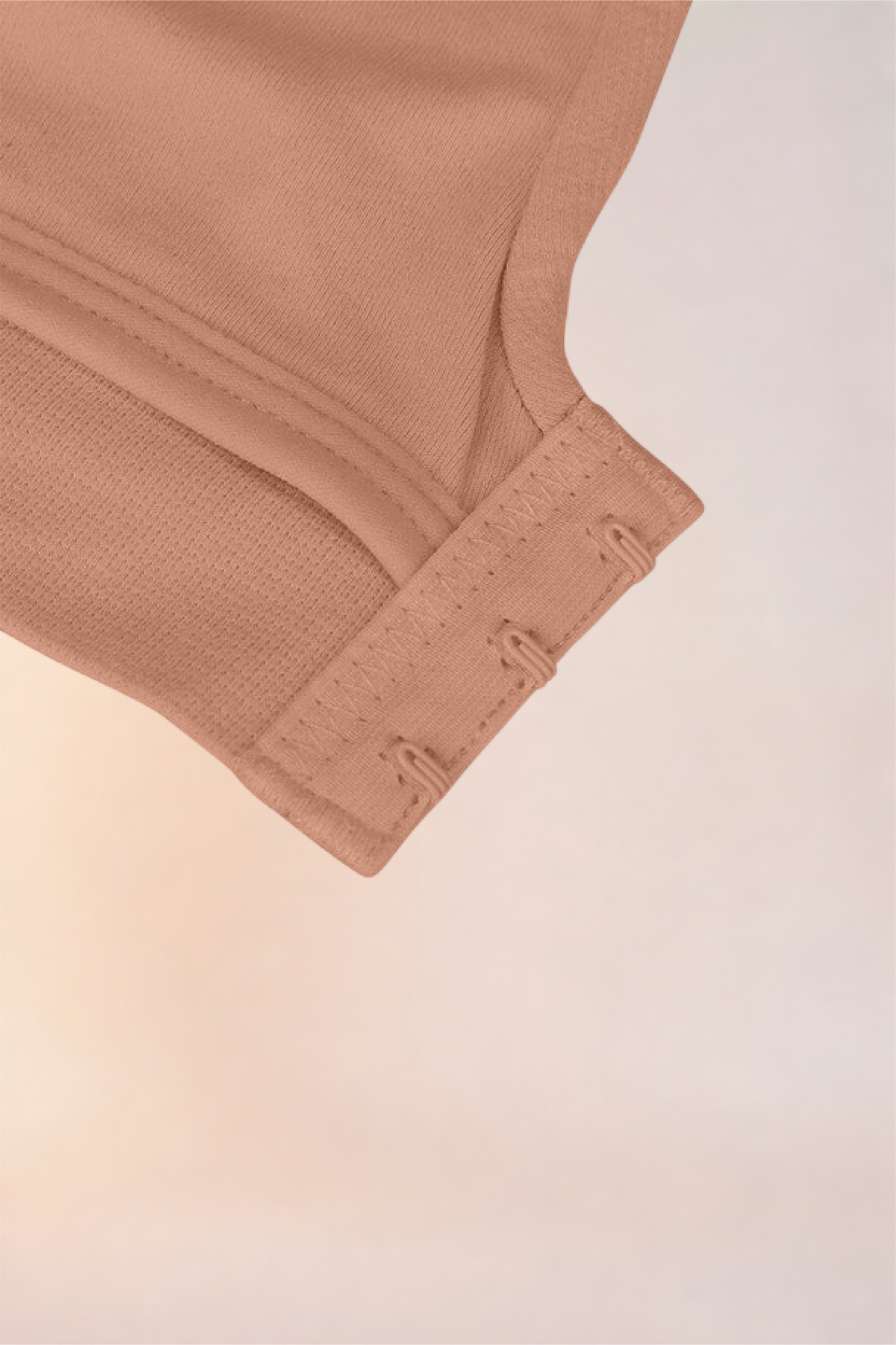 Flat lay of the Skinzform Nuage Bra in Latte showing the hook-and-eye band
