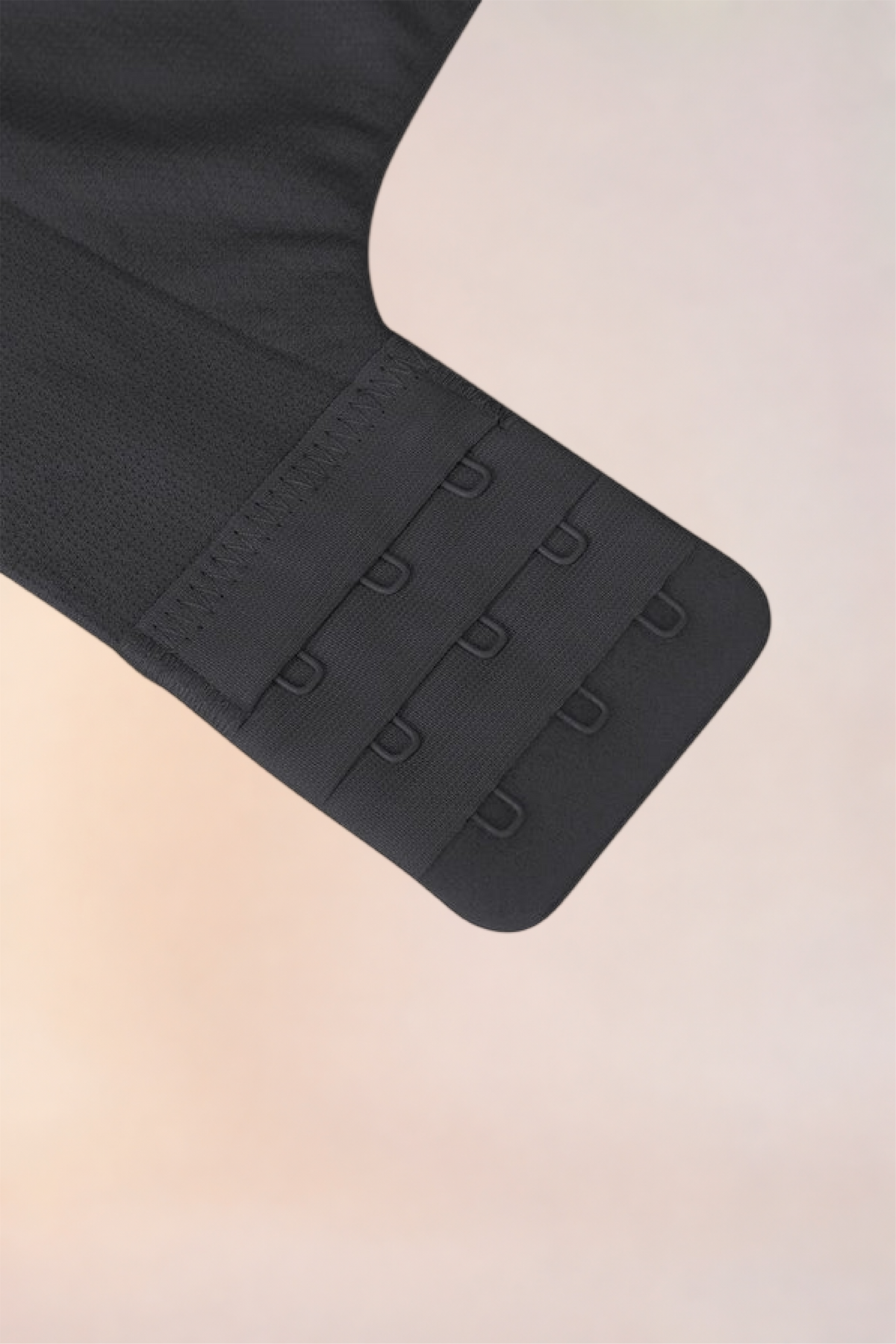 Flat lay of the Skinzform Nuage Bra in Noir showing the hook-and-eye band