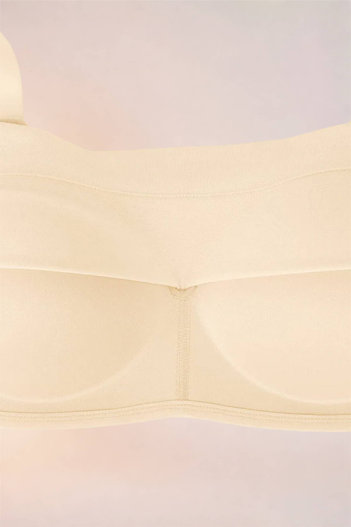 Flat lay of the Skinzform Nuage Bra in Nude showing the moulded cups