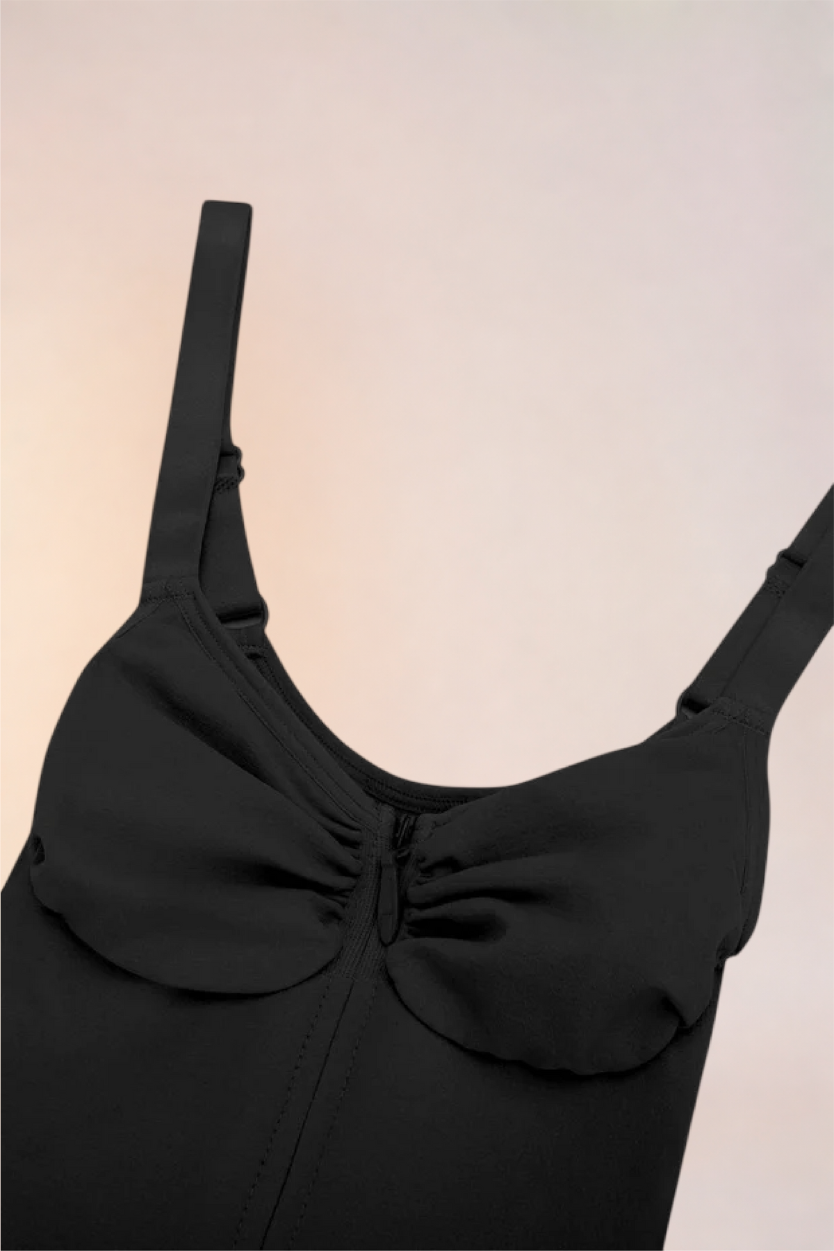 Close-up of the bust panel and straps on the Skinzform Core Brief in Noir