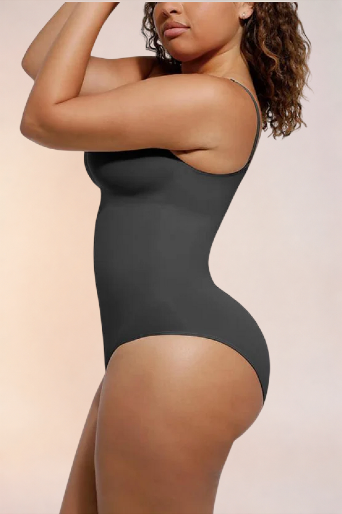 Skinzform Core Brief in Noir, side profile on the model