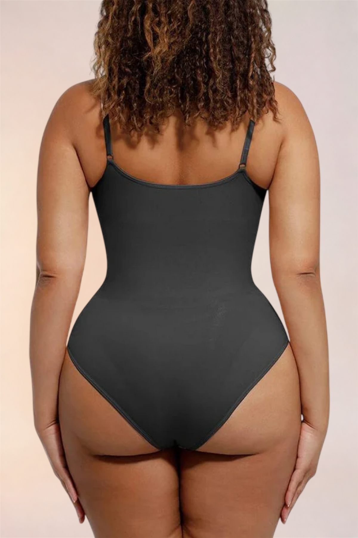 Close-up of the thong-cut back on the Skinzform Core Brief in Noir