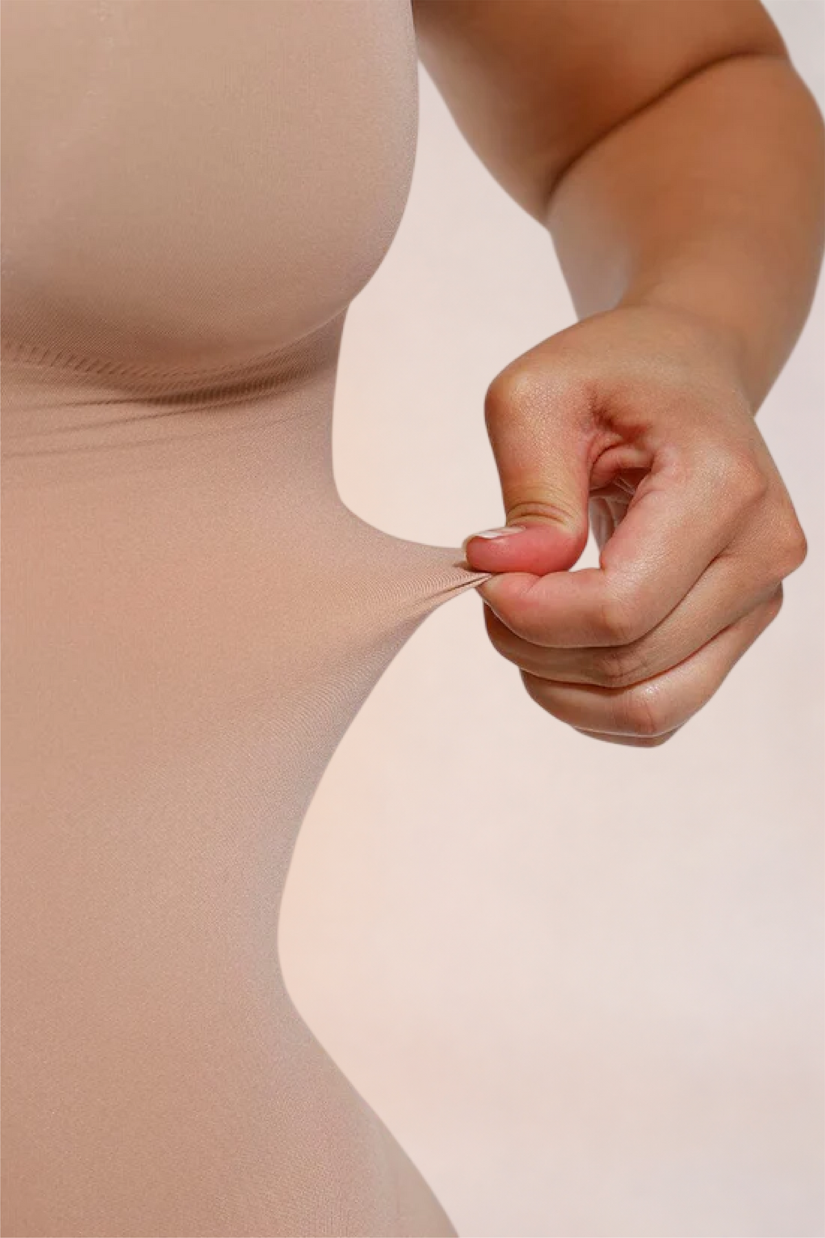 Skinzform Core Brief in Nude - fabric pinched to show the stretch