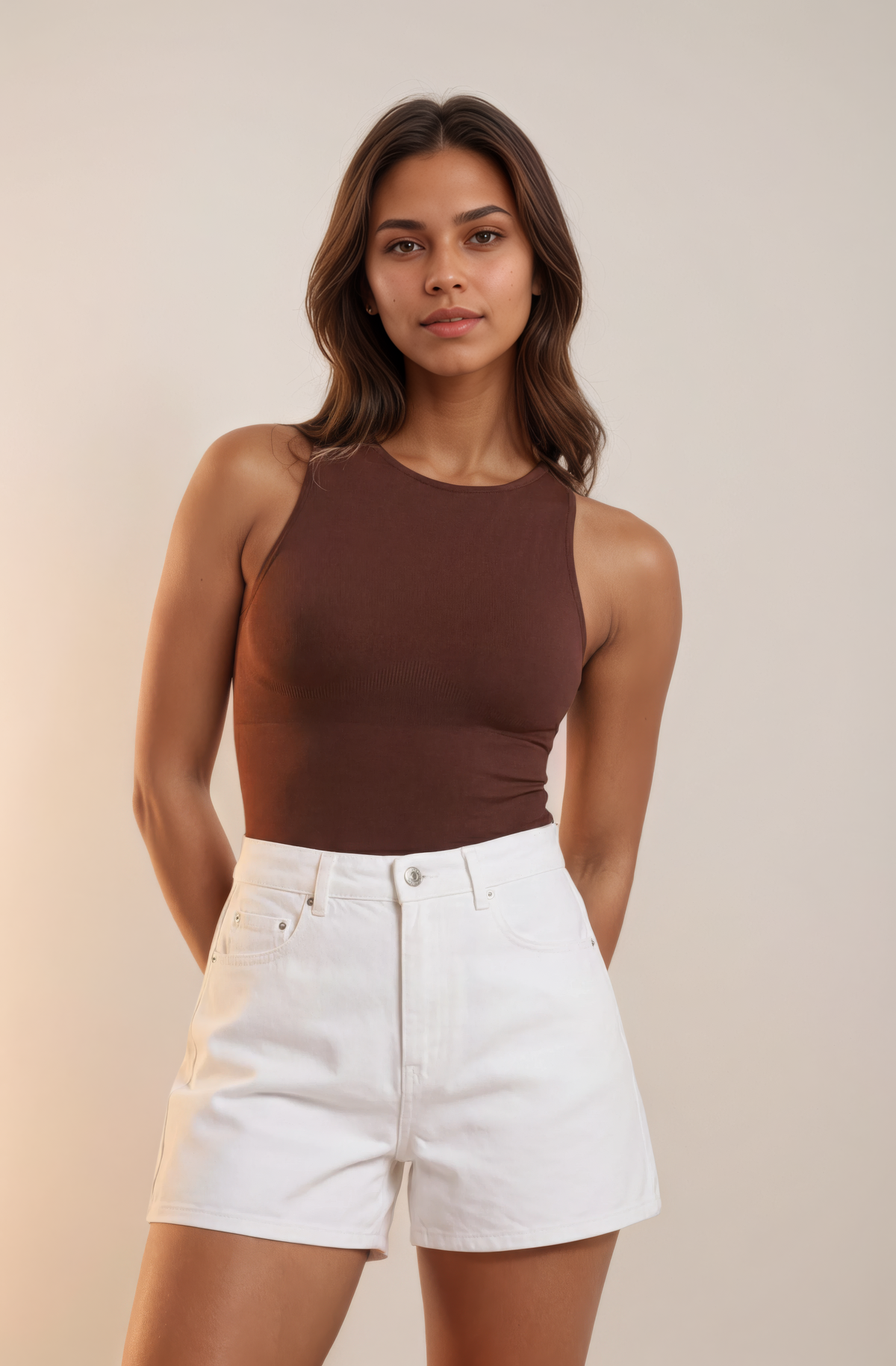 Skinzform Crew Bodysuit in Cacao styled with white denim shorts, half-length front view