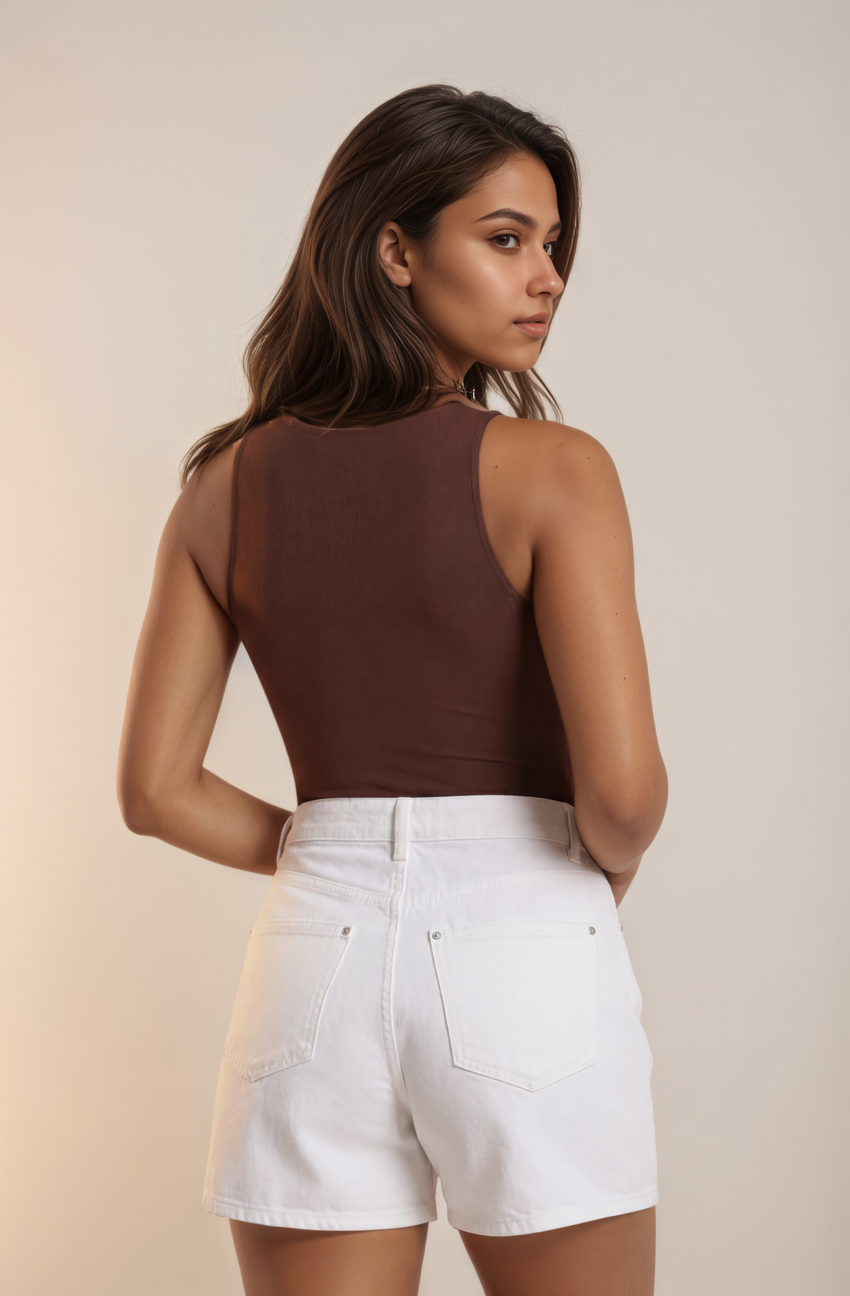 Skinzform Crew Bodysuit in Cacao styled with white denim shorts, back view