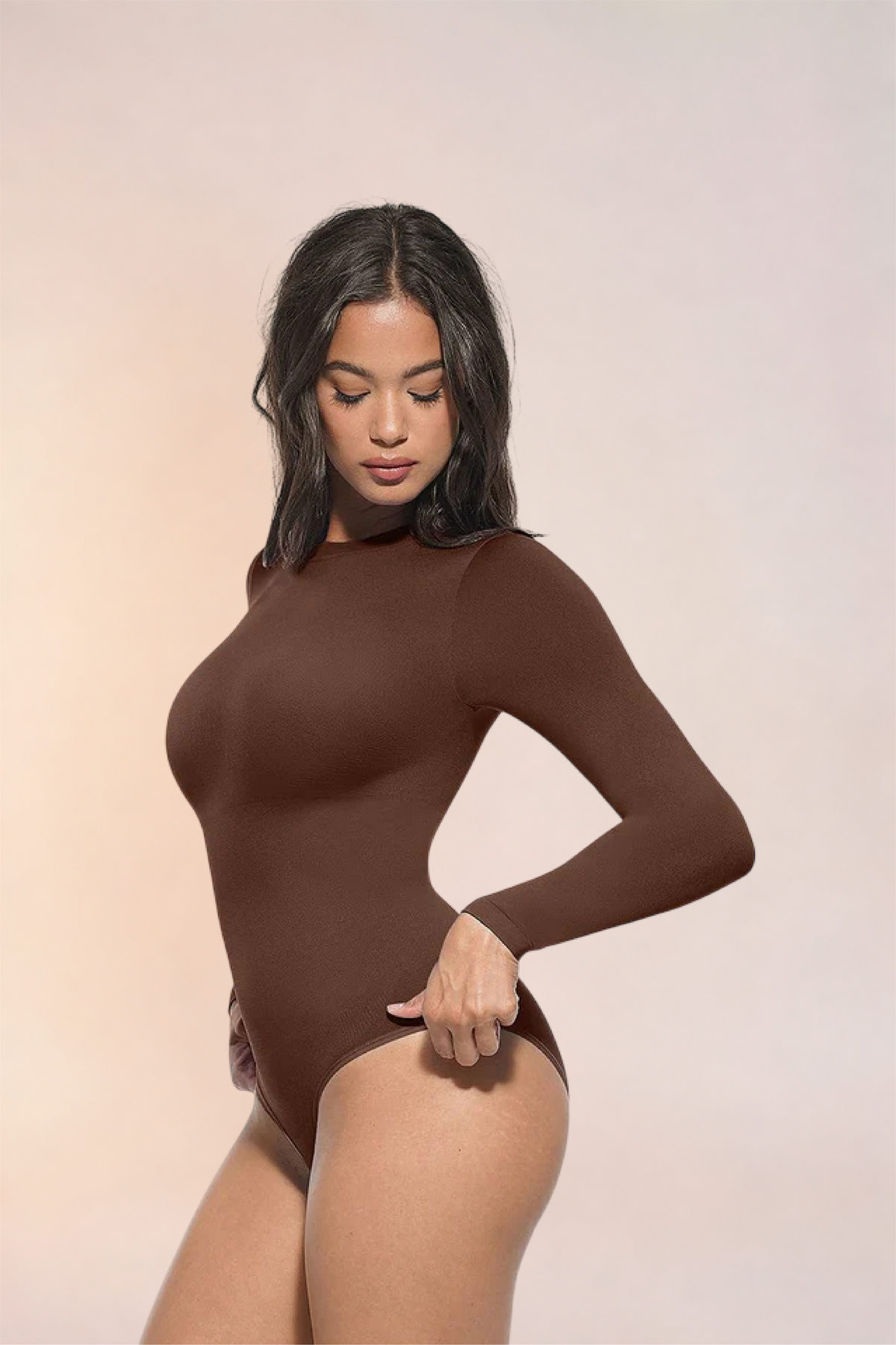 Skinzform Peach Round-Neck Brief in Cacao, front view on the model with a hand at the hip