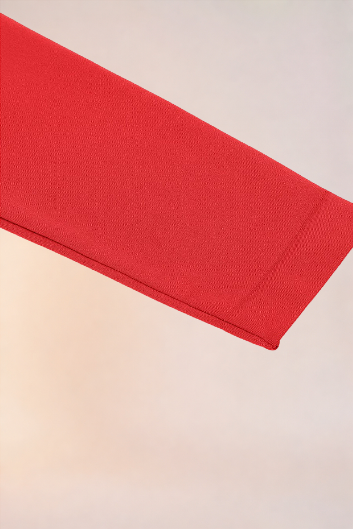 Flat lay of the sleeve cuff on the Skinzform Peach Round-Neck Brief in Rouge