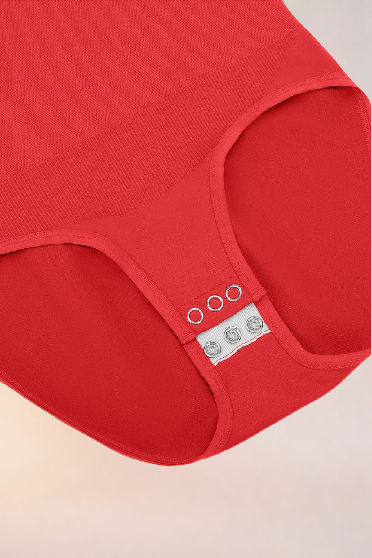 Flat lay of the Skinzform Peach Round-Neck Brief in Rouge showing the snap gusset
