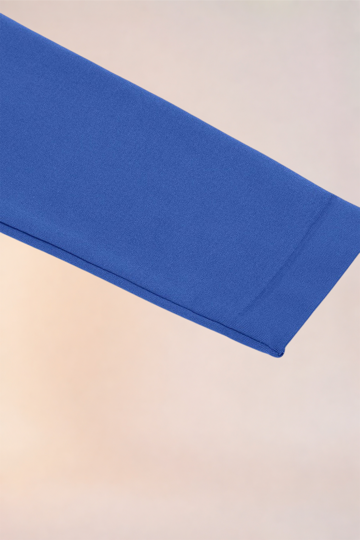 Flat lay of the sleeve cuff on the Skinzform Peach Round-Neck Brief in Royal Blue