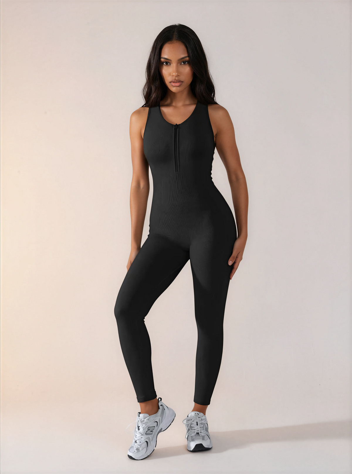 Skinzform Racer Bodysuit in Noir worn with trainers, full-length front view