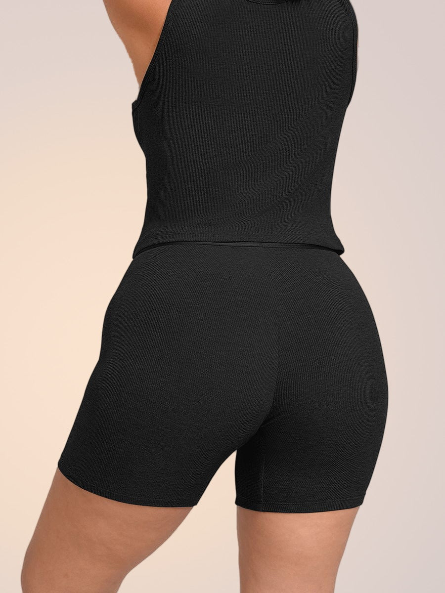 Skinzform Ribbed Tank in Noir styled with matching shorts, angled back view
