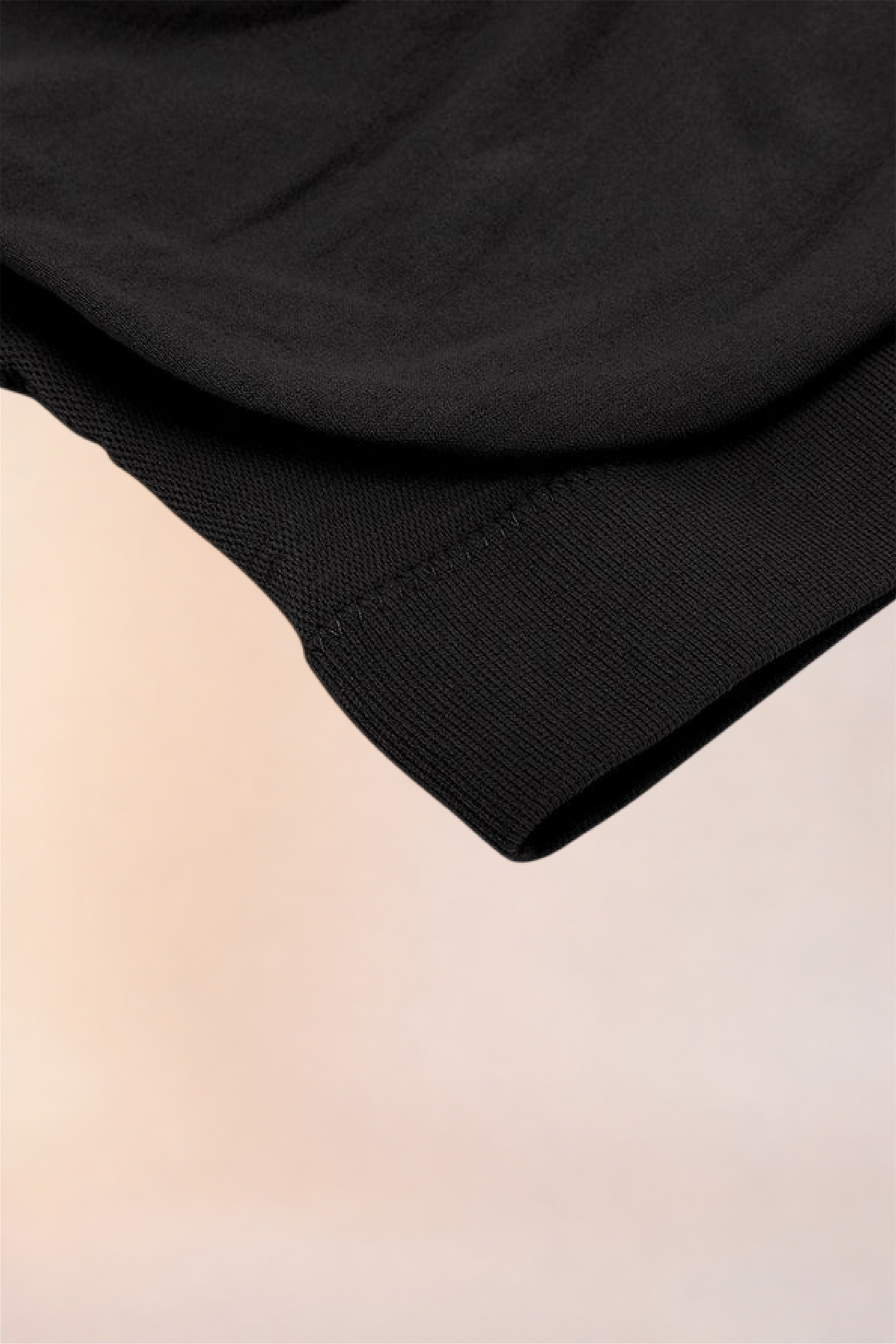 Close-up of the ribbed underband on the Skinzform Scoop Bralette in Noir