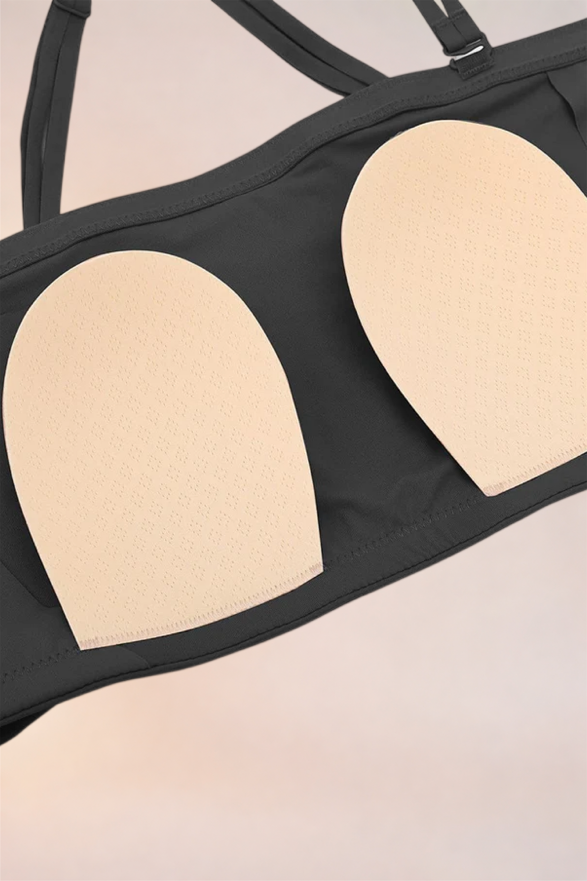 Close-up of the cups and removable pads on the Skinzform Scoop Bralette in Noir