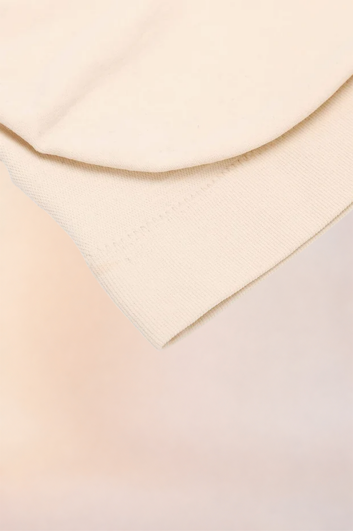 Close-up of the folded hem and underband on the Skinzform Scoop Bralette in Nude