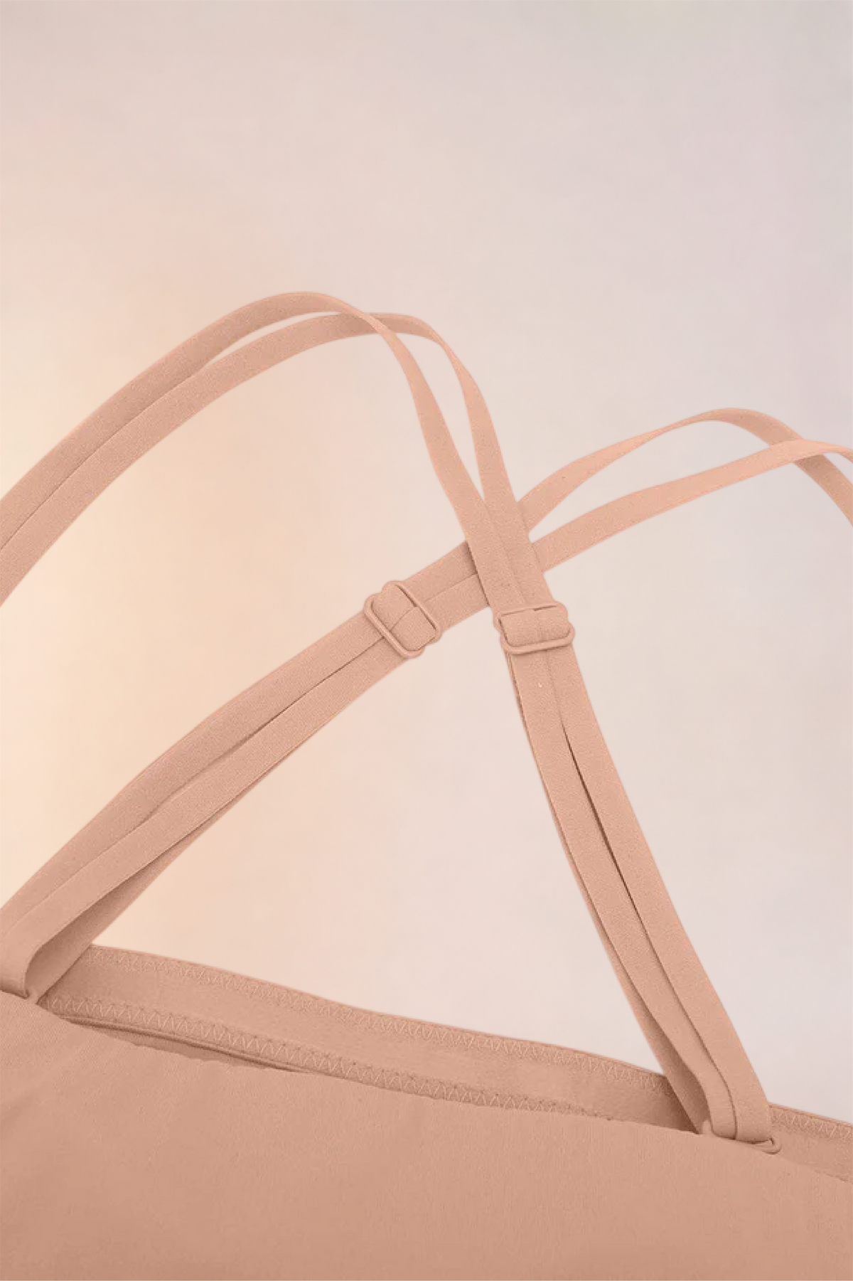 Close-up of the criss-cross straps on the Skinzform Scoop Bralette in Nude