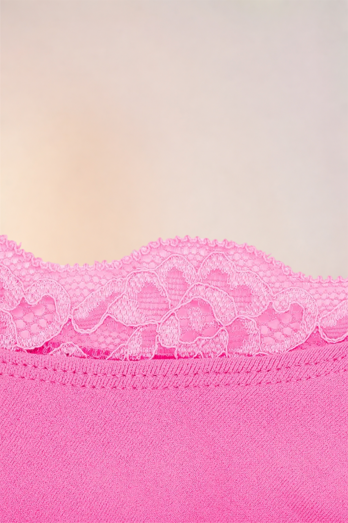 Close-up of the scalloped lace trim on the Skinzform Scoop Bralette in Pink
