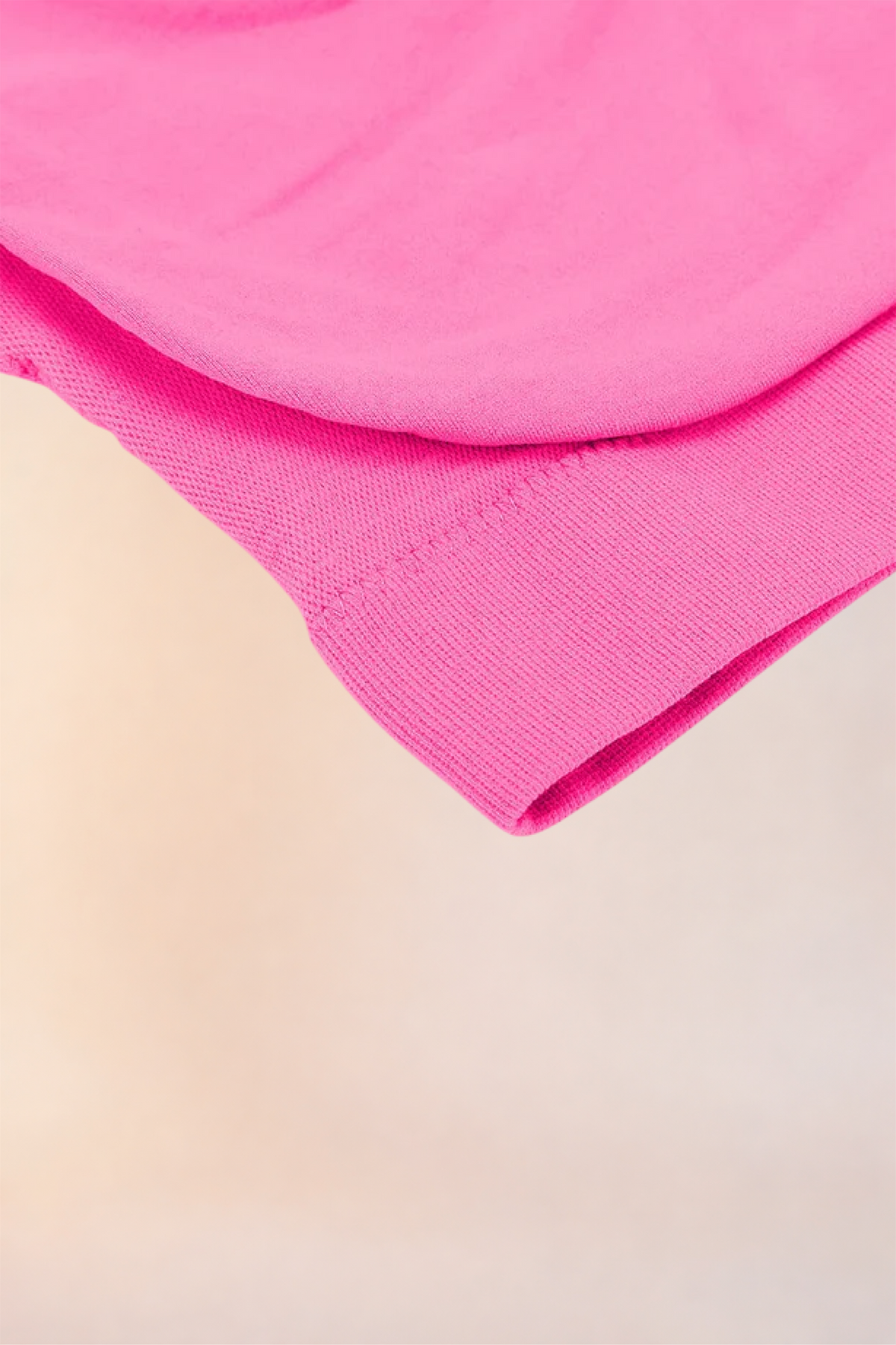 Close-up of the folded hem and underband on the Skinzform Scoop Bralette in Pink