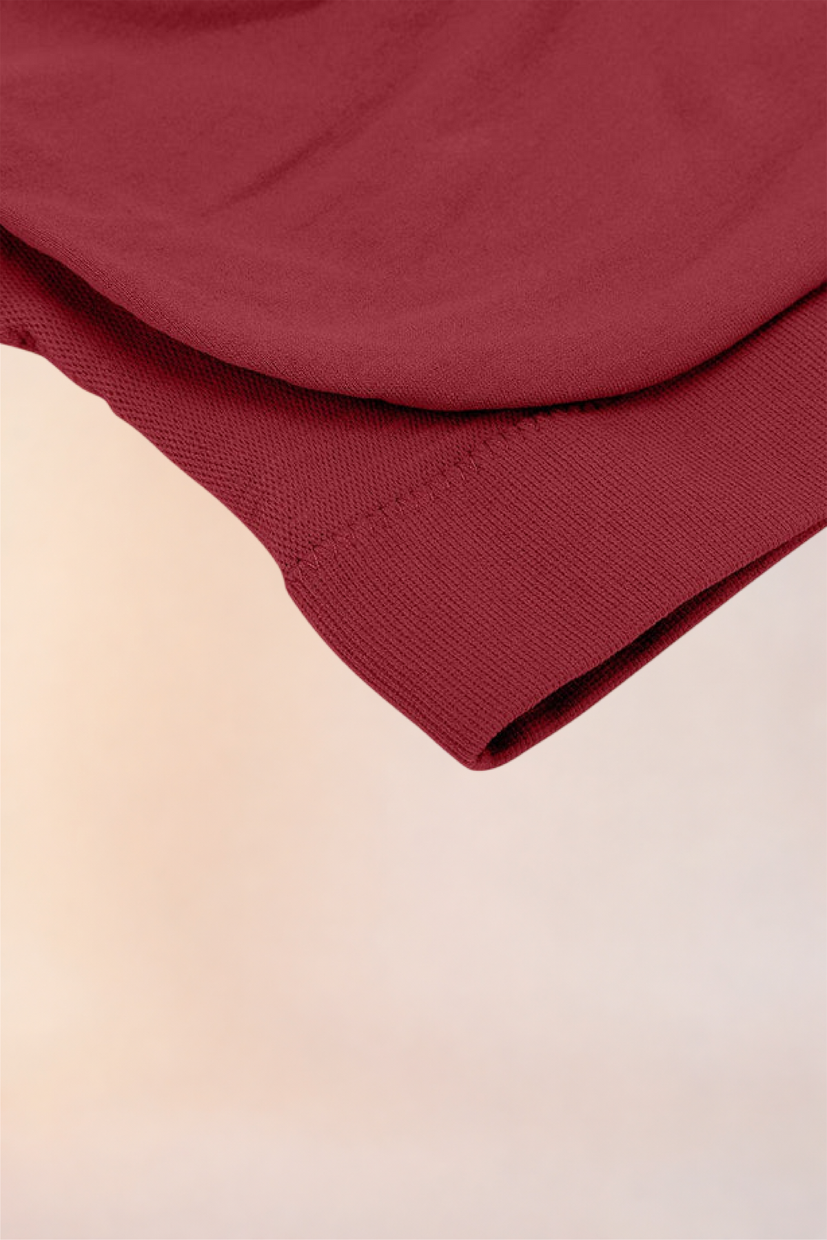 Close-up of the folded hem and underband on the Skinzform Scoop Bralette in Red